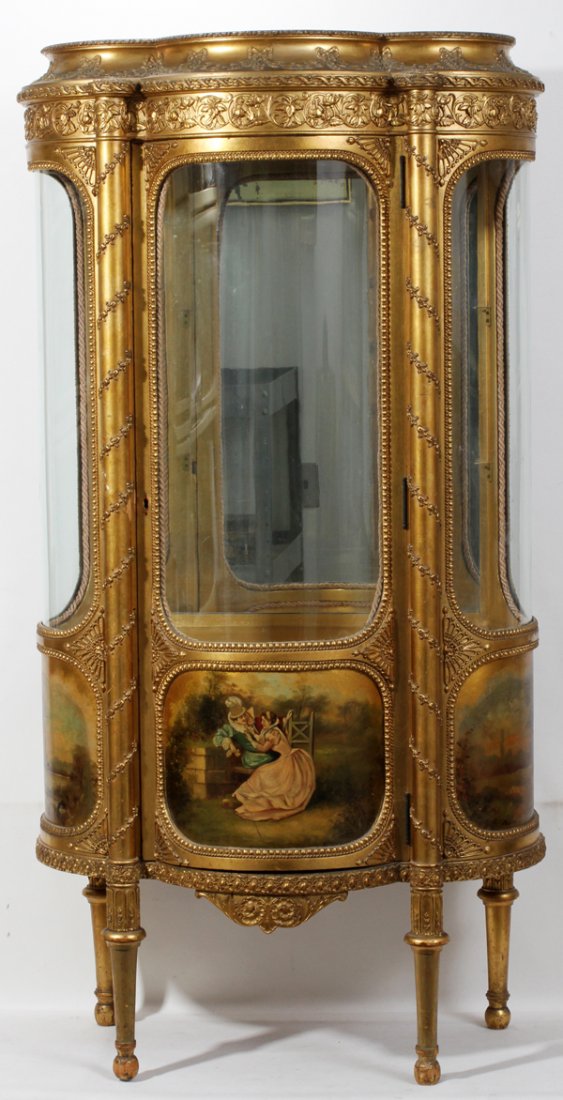 FRENCH STYLE GILT CURIO CABINET, C. 1900, H 57": FRENCH STYLE GILT CURIO CABINET, C. 1900, H 57", W 30", D 17":Demi lune, having hand blown curved glass in door panel as well as side panels. Two glass shelves, mirror back.
