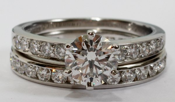 TIFFANY & CO. DIAMOND & PLATINUM WEDDING SET: TIFFANY & CO. DIAMOND & PLATINUM WEDDING SET, SIZE 7:Taken from Retail Replacement Valuation from Tiffany & Co. 2002 and 2003: "One Tiffany & Co. platinum, diamond solitaire ring set with one round br