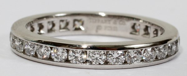 TIFFANY & CO. DIAMOND & PLATINUM ETERNITY BAND: TIFFANY & CO. DIAMOND & PLATINUM ETERNITY BAND, SIZE 7:Taken from Retail Replacement Valuation from Tiffany & Co. 2003: "One (of two, originally) Tiffany & Co. diamond band ring(s) set in platinum wit
