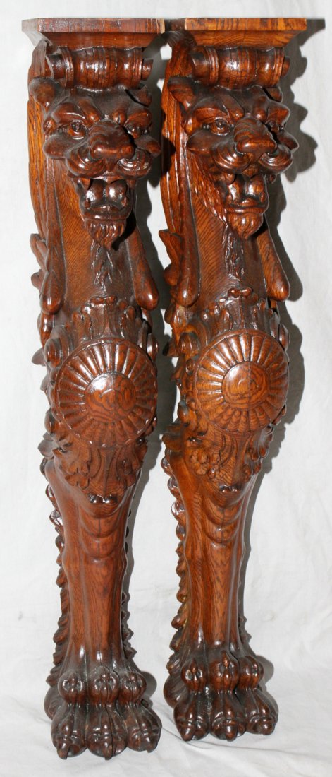 CARVED OAK GRIFFIN CORBELS, PAIR, H 36", W 6",: CARVED OAK GRIFFIN CORBELS, PAIR, H 36", W 6", D 6":Each carved baring teeth and ending in paw foot. Early 20th century.