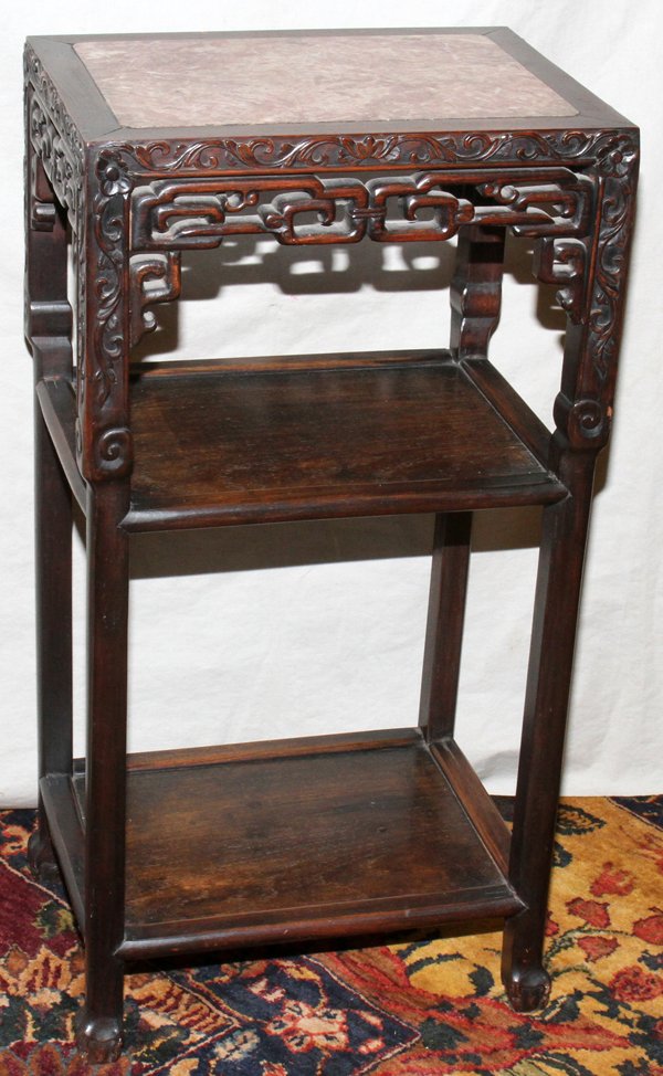 CHINESE TEAKWOOD STAND WITH MARBLE TOP, 19TH C.: CHINESE TEAKWOOD STAND WITH MARBLE TOP, 19TH C., H 31", W 16", D 12":Having three tiers.
