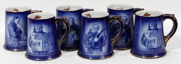 STAFFORDSHIRE MUGS, LOT OF SIX: STAFFORDSHIRE MUGS, LOT OF SIX:Advertising mugs with blue transfer decoration, advertising for A S & Co. inside is decorated with either a frog playing instruments or monkeys. Circa 1890