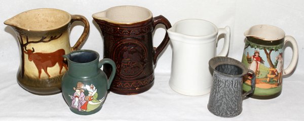 ANTIQUE PITCHERS, LATE 19TH-EARLY 20TH C., SIX: ANTIQUE PITCHERS, LATE 19TH-EARLY 20TH C., SIX, H 5"-8":Including 1 tin 1/2 quart size, 1 transfer decorated signed "Peirce", 2 pottery, 1 ironstone, and 1 with motif of cow below a tree, possibly Ros