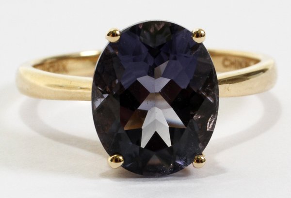 14 KT YELLOW GOLD RING WITH BLUE STONE: 14 KT YELLOW GOLD RING WITH BLUE STONE, SIZE 7 1/4:Oval cut solitaire with 14 kt yellow gold band. Stamped "14K" and "China".