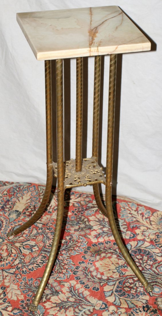 FRENCH EMPIRE STYLE BRASS & ONYX STAND: FRENCH EMPIRE STYLE BRASS & ONYX STAND, H 32", W 12", L 12":Square onyx top rests on twisted brass supports which terminate on paw feet. From the Estate of Jordan Besh, Birmingham, Mi.