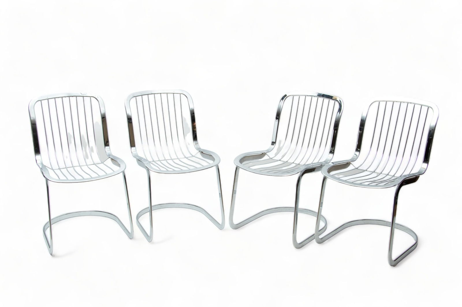 Willy Rizzo for Cidue (Italian) Chromed Steel Chairs, Ca. 1970, H 31" W 17" Depth 22" 4 pcs: Willy Rizzo for Cidue (Italian) Chromed Steel Chairs, Ca. 1970, H 31" W 17" Depth 22" 4 pcs | the collection of cantilevered chrome plated steel chairs are without their original cushions. with 'Cidue