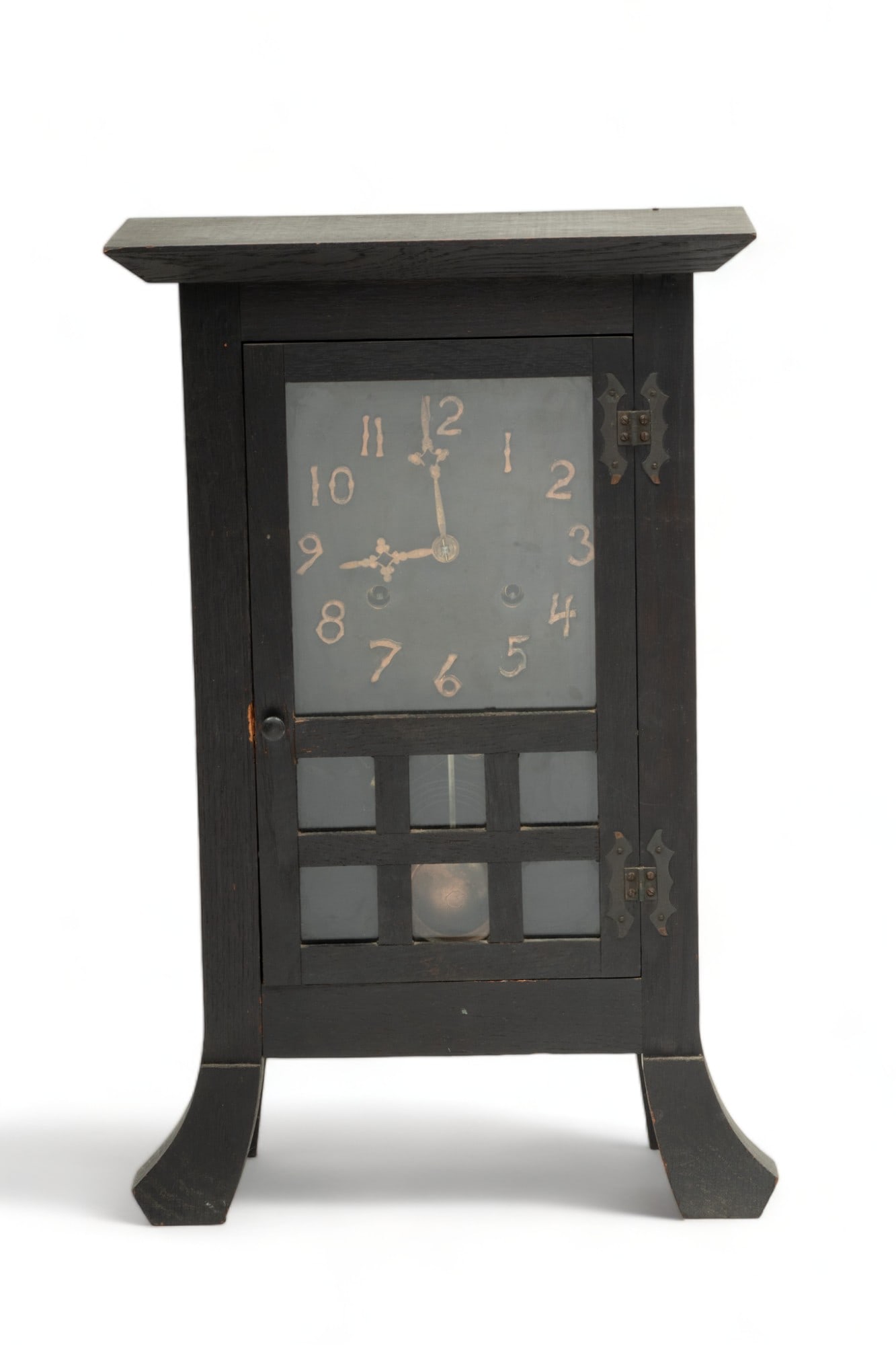 New Haven Clock Co. (American) Mission Style Oak Mantel Clock, Ca. 1900, H 19" W 12" Depth 5.5": New Haven Clock Co. (American) Mission Style Oak Mantel Clock, Ca. 1900, H 19" W 12" Depth 5.5" | the mantel clock offers a hinged glass door revealing stylized Arabic numeral hour markers. a 2-key wi