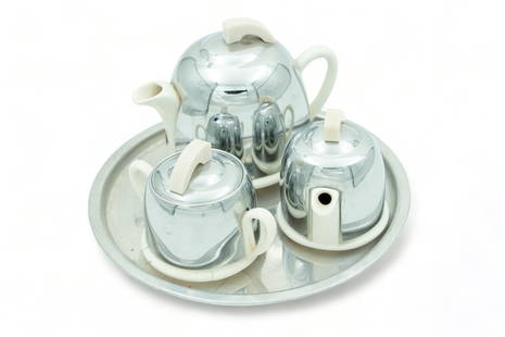 English Art Deco Stoneware & Chromed Steel Children's Tea Service Set, Ca. 1930, H 4.5" W 3.5" L: English Art Deco Stoneware & Chromed Steel Children's Tea Service Set, Ca. 1930, H 4.5" W 3.5" L 5.5" 4 pcs | the collection includes a covered teapot (H 4.5" X W 3.5" X L 5.5"), a covered creamer, a