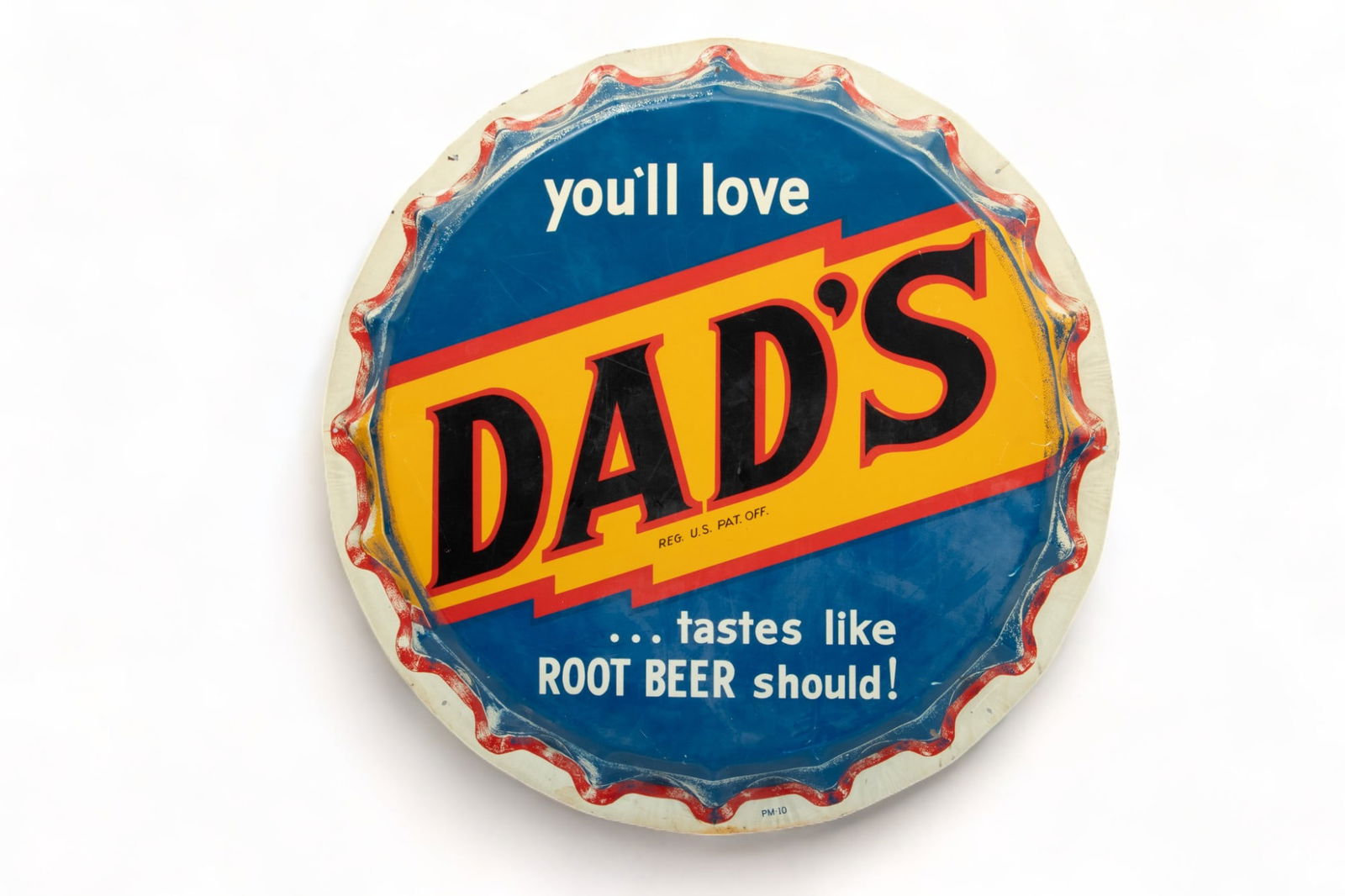 Porcelain Enamel on Tin Dad's Root Beer Advertising Sign Ca. 1950-1960, Dia. 29": Porcelain Enamel on Tin Dad's Root Beer Advertising Sign Ca. 1950-1960, Dia. 29" | Having 20 punched knurled teeth at rim. Green porcelain verso. Provenance: Property of a Detroit, MI Private Collecto