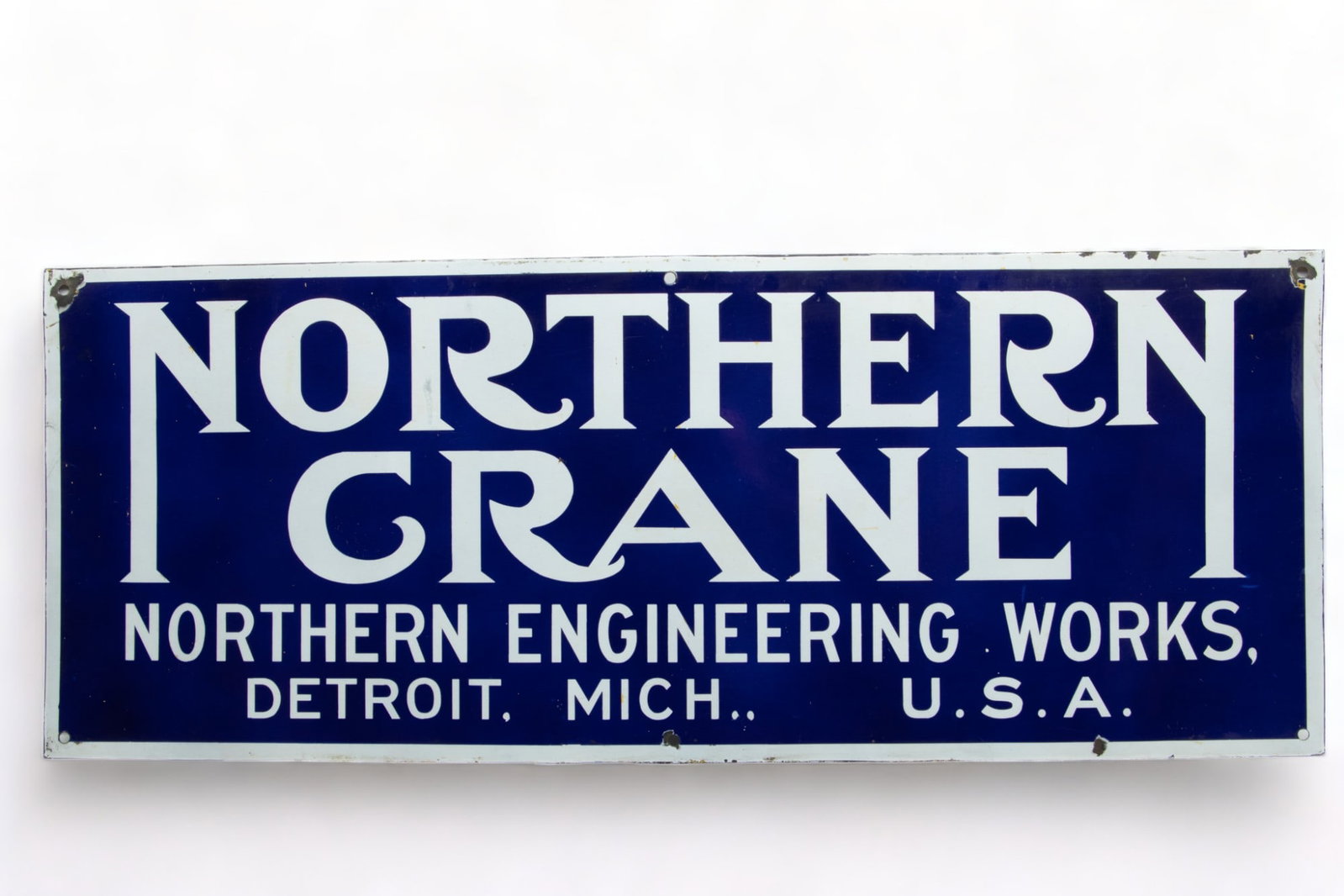 Northern Crane, Northern Engineering Works, Detroit, MI. Single Sided Porcelain Enamel Sign, Ca.: Northern Crane, Northern Engineering Works, Detroit, MI. Single Sided Porcelain Enamel Sign, Ca. 1940s, H 21.75" W 56" | Blue field with white lettering. Northern Crane, Northern Engineering Works, De