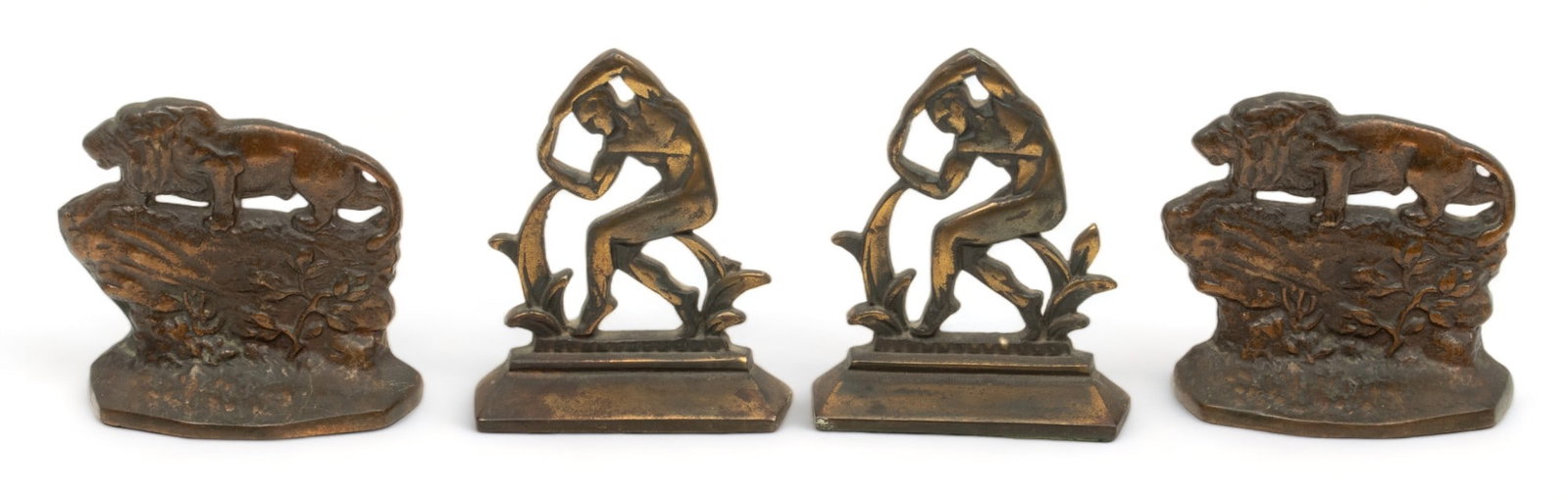 Cast Iron Bookends: Nude Male Dancer And Crouching Lions Ca. 1900, H 5" L 5.5" 2 Pairs: Cast Iron Bookends: Nude Male Dancer And Crouching Lions Ca. 1900, H 5" L 5.5" 2 Pairs | Art Deco male nude dancing amongst stylized plants. H 6" L 5". Also pair cast iron lion bookends H 5.5" L 5.7"
