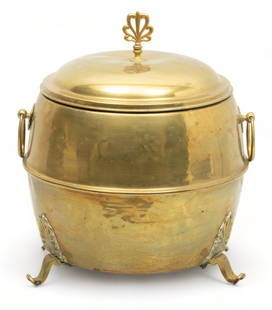 English Brass Covered Coal Scuttle, Ca. 1900, H 16.5" Dia. 12": English Brass Covered Coal Scuttle, Ca. 1900, H 16.5" Dia. 12" | the covered coal scuttle offers a flame form handle and a tri-footed base. with brass marks to the underside. Provenance: Bearing a The