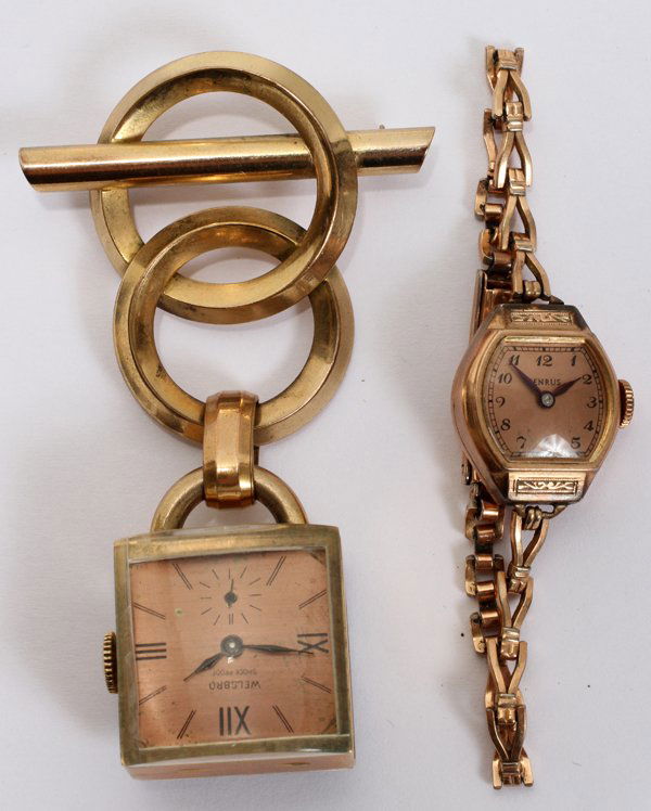 LADY'S WATCHES, 2: LADY'S WATCHES, 2:One Benrus 10 karat gold filled wristwatch and one Welsbro Watch Company watch pin hanging from 2 gold toggles. Pin is marked "MV20-12 karat" on back of watch. Also marked "Welsbro"