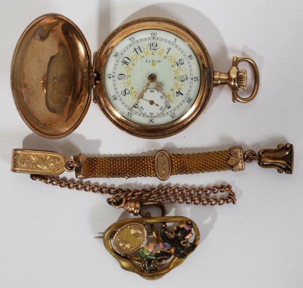 ELGIN GOLD FILLED LADY'S POCKET WATCH: ELGIN GOLD FILLED LADY'S POCKET WATCH:With enameled face and "Guaranteed of Twenty Years (Philadelphia Watch Case Co.)" at the interior of the cover over the works. Includes a coordinating chain, fob,