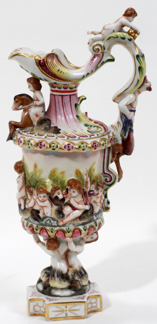 CAPODIMONTE PORCELAIN EWER C. 1900-1910,: CAPODIMONTE PORCELAIN EWER, CHERUBS IN HIGH BAS RELIEF, C. 1900-1910, H CA. 10":