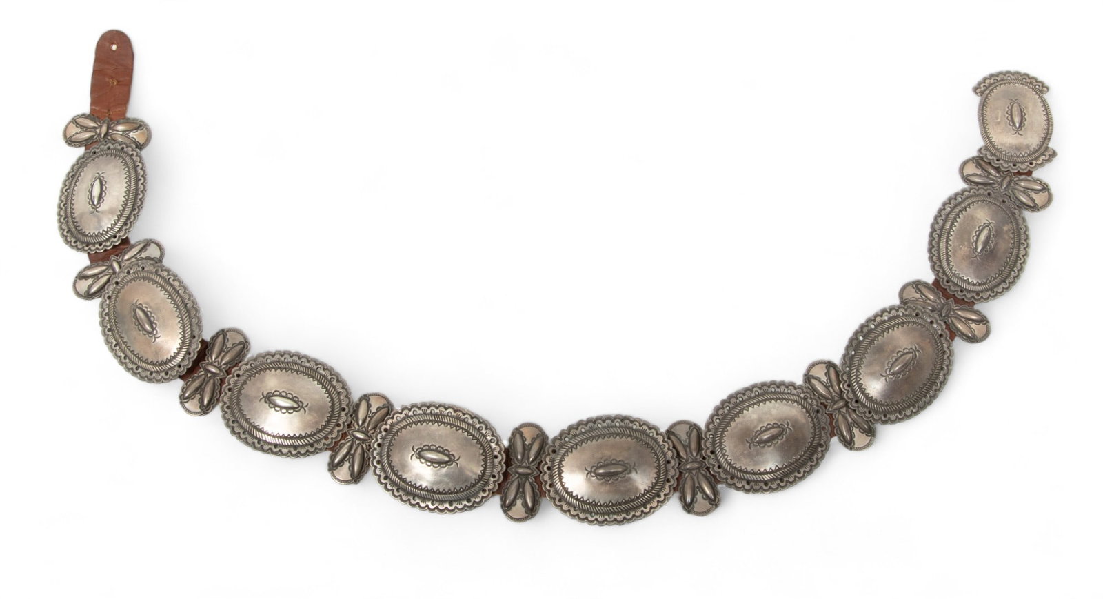 Perry Shorty (American Navajo, B. 1964) Chased Sterling Silver Belt, Concha & Butterfly, W 2" L 31": Perry Shorty (American Navajo, B. 1964) Chased Sterling Silver Belt, Concha & Butterfly, W 2" L 31" 365g | the belt contains nine concha ornaments (W 2" X L 2.5") alternating with nine butterfly ornam