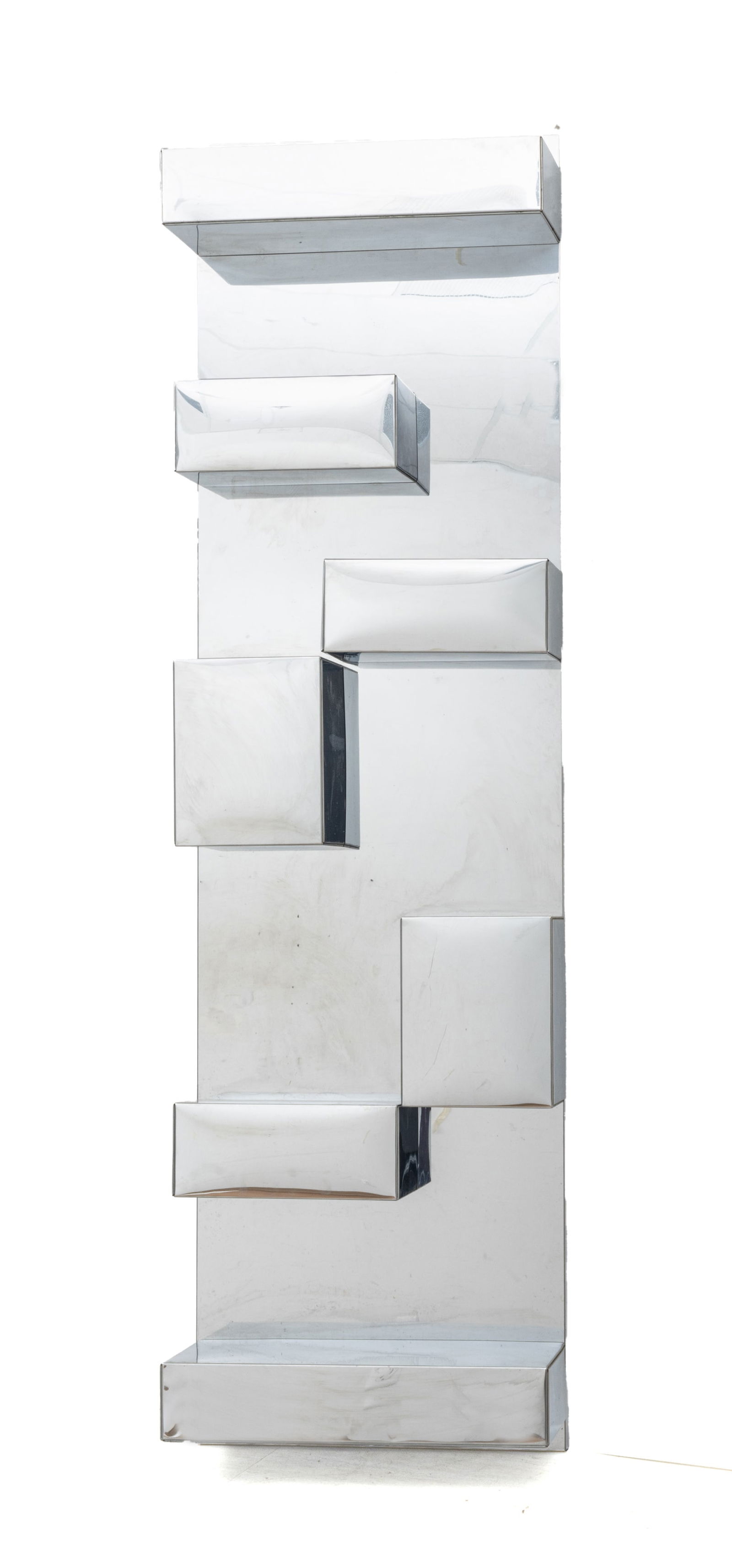 Milo Baughman (American, 1923-2003) Stainless Steel Wall Shelving Unit Ca. 1970, H 72" W 20.25": Milo Baughman (American, 1923-2003) Stainless Steel Wall Shelving Unit Ca. 1970, H 72" W 20.25" Depth 11" | a very well-crafted wall mounted shelving unit with seven removable box shelves and wall bac