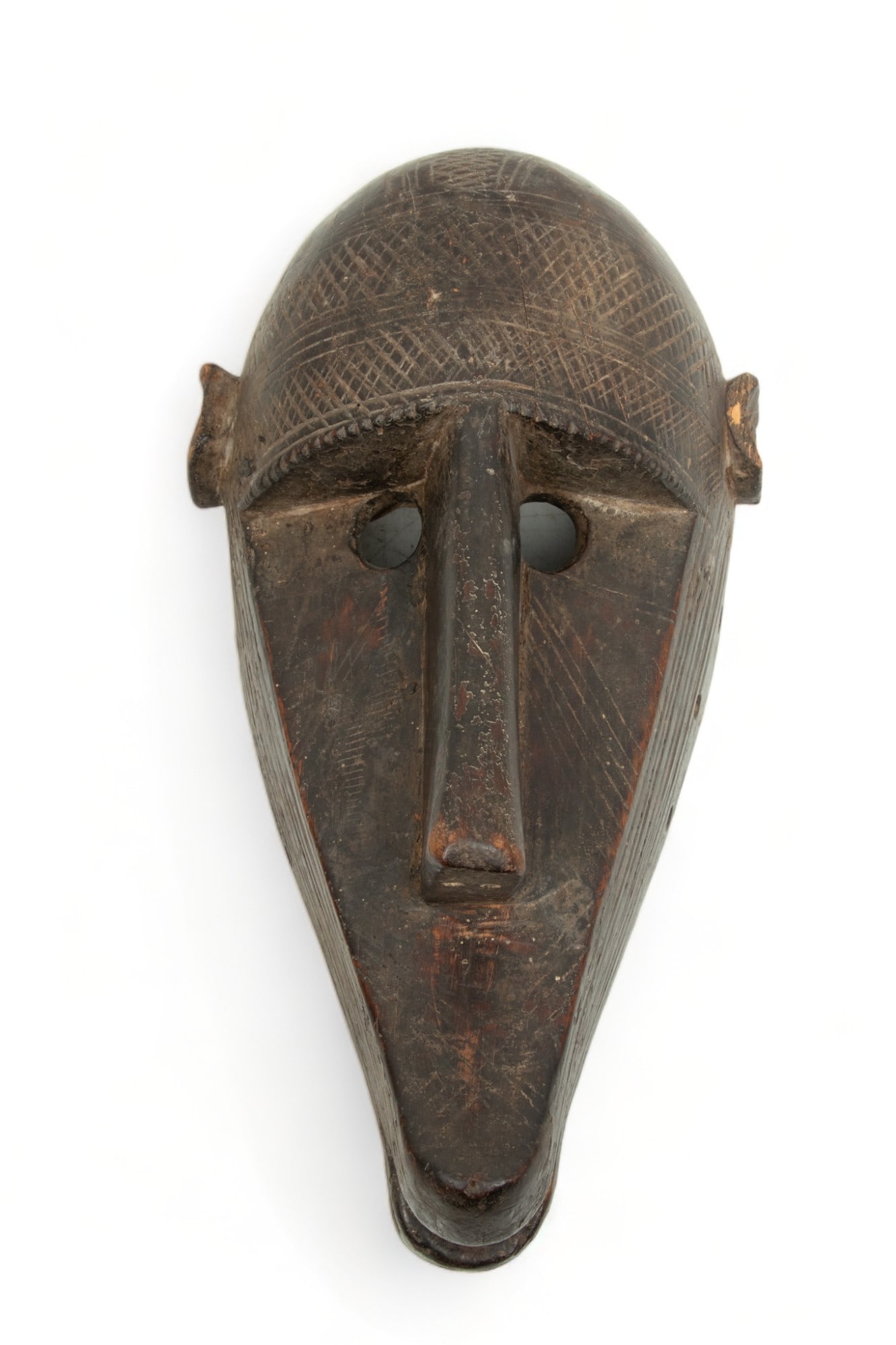 Mali, Bamana of Malinke Peoples, Carved Wood Mask: Monkey (N'Gon Koun), Ca. 20th Century, H 13" W 6": Mali, Bamana of Malinke Peoples, Carved Wood Mask: Monkey (N'Gon Koun), Ca. 20th Century, H 13" W 6" | Mask combining animal and human traits called n'gon koun, meaning “monkey,” most like