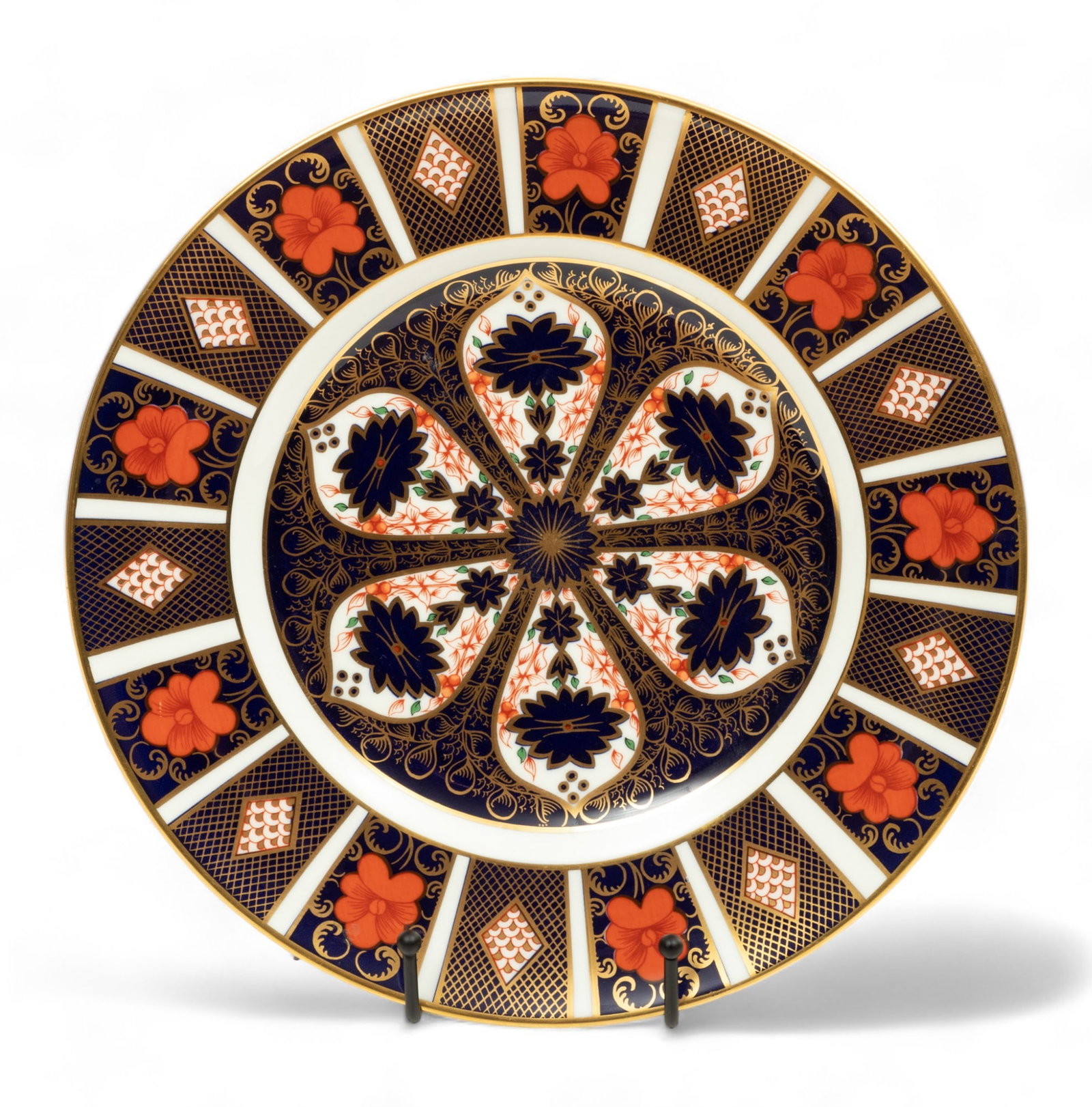 Royal Crown Derby (English) Bone China Charger "Imari Pattern", Dia. 11": Royal Crown Derby (English) Bone China Charger "Imari Pattern", Dia. 11" | Blue, rust, and fired gold floral and leaf design. Makers marked on underside, #1128 XL. Provenance: Southfield, Mi private c