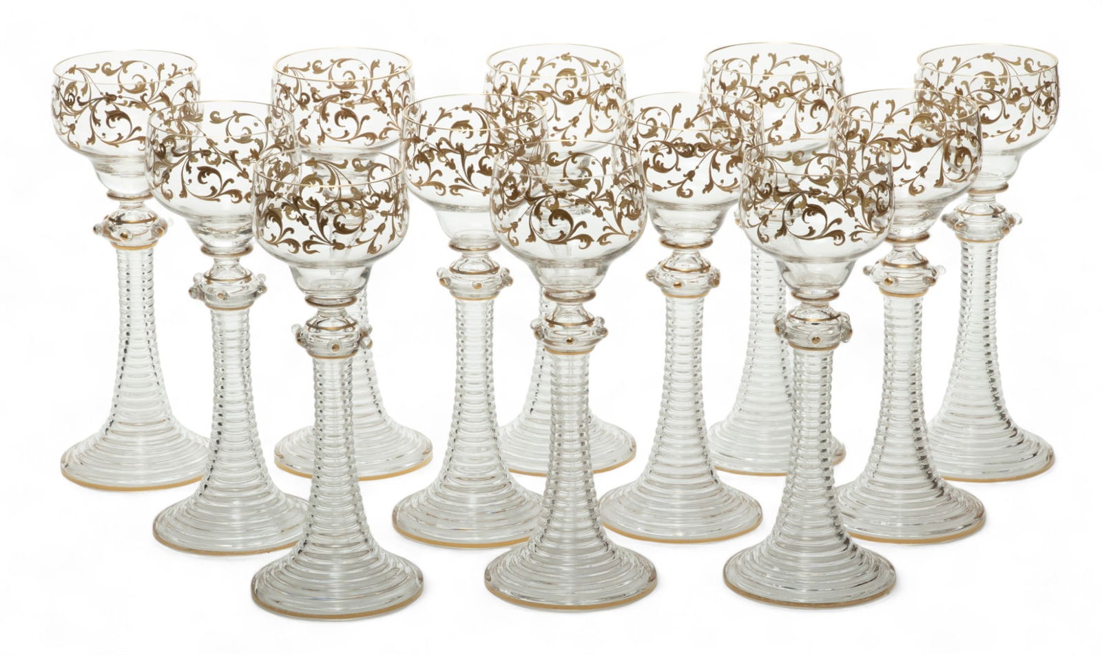 Blown Glass with Fired Gold Trim Rhine Wine Goblets, Ca. 1900, H 8" Dia. 3" 12 pcs: Blown Glass with Fired Gold Trim Rhine Wine Goblets, Ca. 1900, H 8" Dia. 3" 12 pcs | the glasses offer fired raised gilding decoration to the cups. Terminating on ribbed handles and bases. Circa 1900.