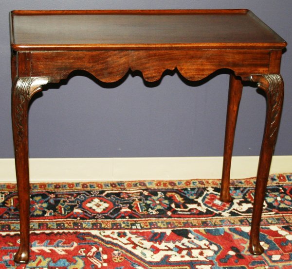 18TH.C. MAHOGANY TEA TABLE, H 29", W 34", D 19": 18TH.C. MAHOGANY TEA TABLE, H 29", W 34", D 19":rectangular top with raised edge, contoured skirt and carved cabriole legs.