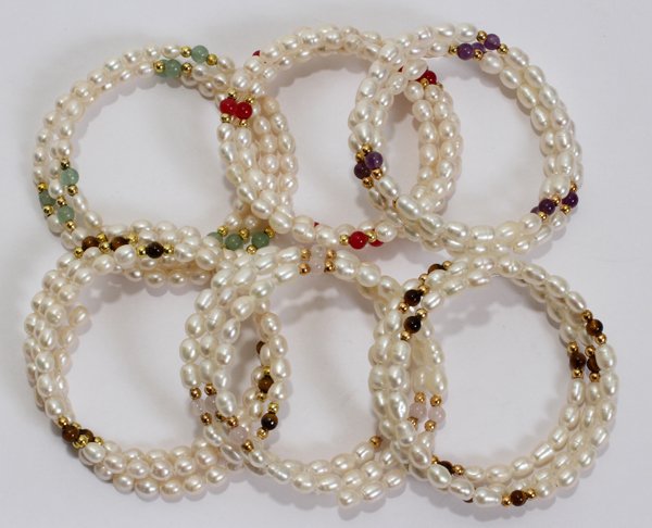 WRAP BRACELETS, SIX: WRAP BRACELETS, SIX:Includes six pearl wrap bracelets with various bead colors.