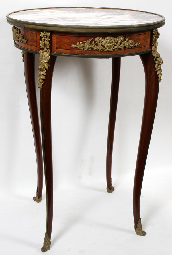 FRENCH MAHOGANY, PARQUETRY & BRONZE TABLE: FRENCH MAHOGANY, PARQUETRY & BRONZE ORMOLU TABLE WITH MARBLE TOP, 19TH C., H 29", DIA 19 3/4":Bronze sabots and chutes. Nice companion to next lot.