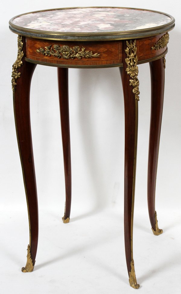 FRENCH MAHOGANY, PARQUETRY & BRONZE TABLE: FRENCH MAHOGANY, PARQUETRY & BRONZE ORMOLU TABLE WITH MARBLE TOP, 19TH C., H 29", DIA 18":A circular marble top above a single drawer fitted in the frieze, raised on cabriole legs with bronze ormolu a