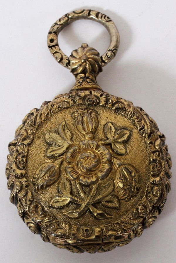 ENGLISH ANTIQUE SILVER GILT VINAIGRETTE, W 2": ENGLISH ANTIQUE SILVER GILT VINAIGRETTE, W 2":In the form of a pocket watch with repousse floral motifs at the exterior, hinges open to grille; hallmarks include a lion passant and "JW" enclosed.