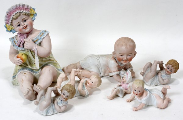 GERMAN BISQUE PIANO BABIES, SEVEN, H 2 1/2"-9": GERMAN BISQUE PIANO BABIES, LATE 19TH-EARLY 20TH C., SEVEN, H 2 1/2"-9":With painted accents.