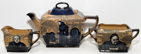ROYAL DOULTON 'MONKS IN THE CELLAR' TEA SET,: ROYAL DOULTON 'MONKS IN THE CELLAR' SERIES WARE TEA SET, C. 1910, THREE PIECES:Including a teapot, creamer and sugar bowl, each decorated in blue transfer on a buff ground; designed and signed by Char
