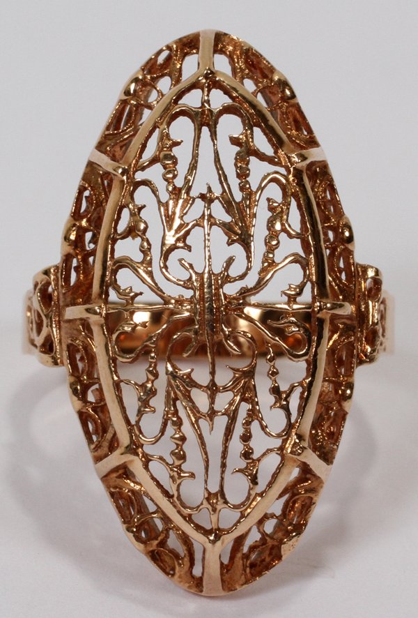 14 KT YELLOW GOLD FILIGREE RING, SIZE 7 1/2: 14 KT YELLOW GOLD FILIGREE RING, SIZE 7 1/2:Stamped with three enclosed hallmarks, two of which are profiles of a man (one with a 3 to the left). Probably Polish. Weighs approximately 5.0 grams.