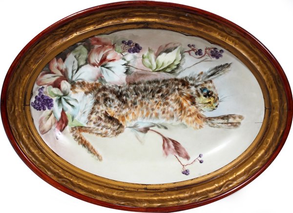 LIMOGES PLATTER, CIRCA 1900, 12" X 17": LIMOGES PLATTER, CIRCA 1900, 12" X 17":Hand painted circa 1900. Rabbit, flower, fruit design, L 17 1/2", W 11 3/4". In an antique mahogany frame. The size of the frame is L 21" x W 15 1/4". It appears