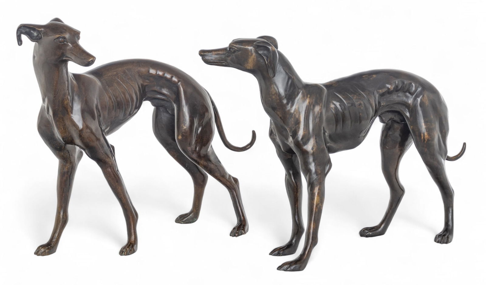 In the Manner of Pierre Jules Mene Bronze Sculptures, Ca. 20th C., "Whippets", H 19.5" L 26" Depth: In the Manner of Pierre Jules Mene Bronze Sculptures, Ca. 20th C., "Whippets", H 19.5" L 26" Depth 7" 1 Pair | Unsigned. Two standing male whippets with a golden-brown patina. Provenance: Property fro
