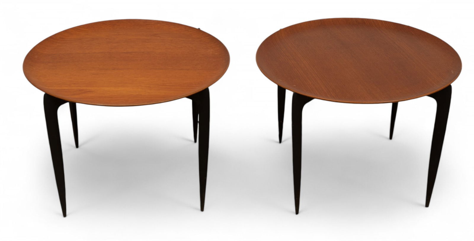 H. Engholm And Sven Aage Willumsen for Fritz Hansen, Teak And Ebonized Wood Tray Tables, Mid 20th: H. Engholm And Sven Aage Willumsen for Fritz Hansen, Teak And Ebonized Wood Tray Tables, Mid 20th C., H 16.5" Dia. 23.5" 2 pcs | Sculpted teak tray tops above collapsable ebonized beechwood legs. Both