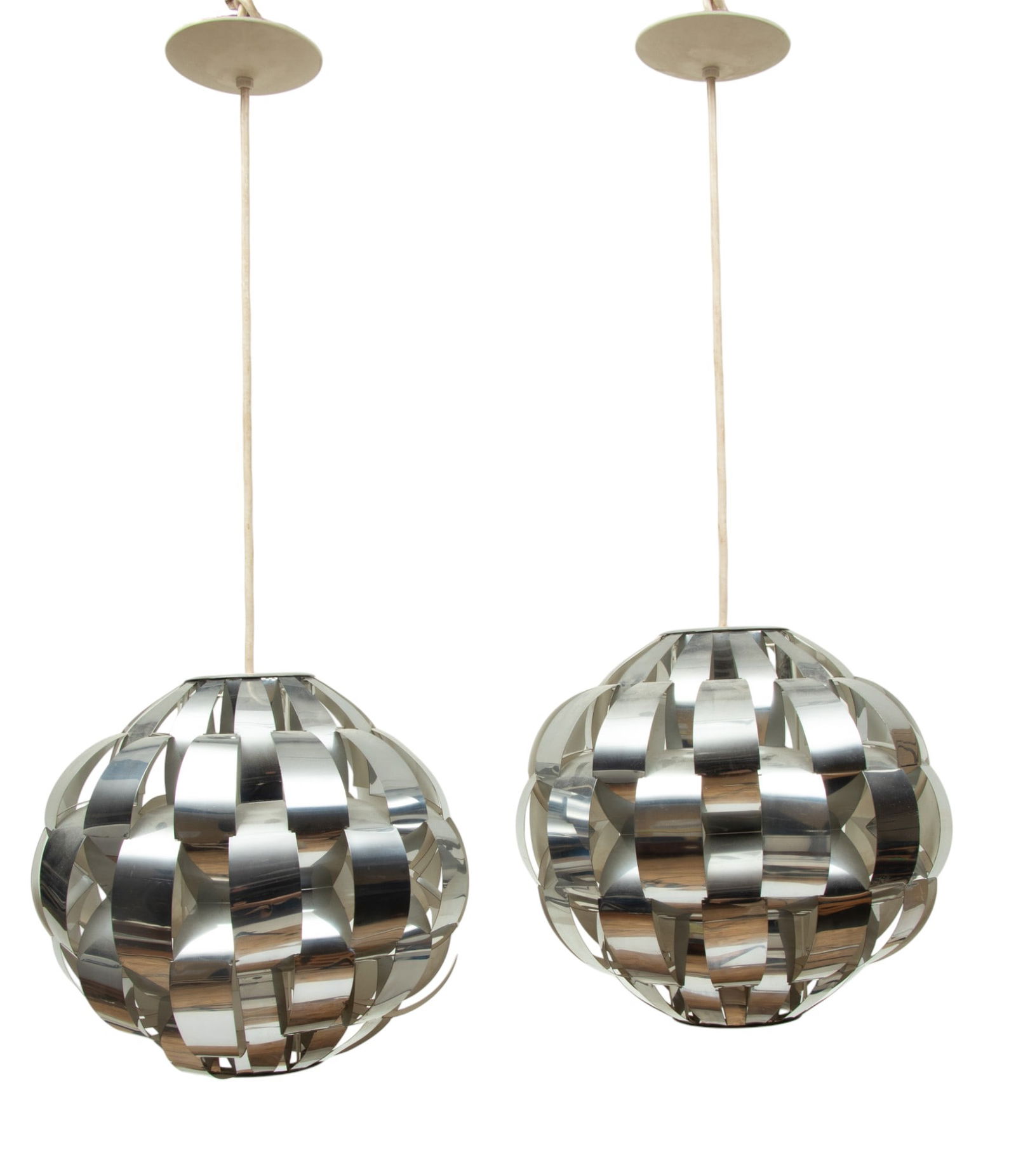 Max Sauze for Lightolier, Ribbon Chandeliers, H 16" Dia. 16" 2 pcs: Max Sauze for Lightolier, Ribbon Chandeliers, H 16" Dia. 16" 2 pcs | Bent and woven bands of stainless steel with white enamel interiors. Single sockets. Includes ceiling caps. Lightolier labels on th