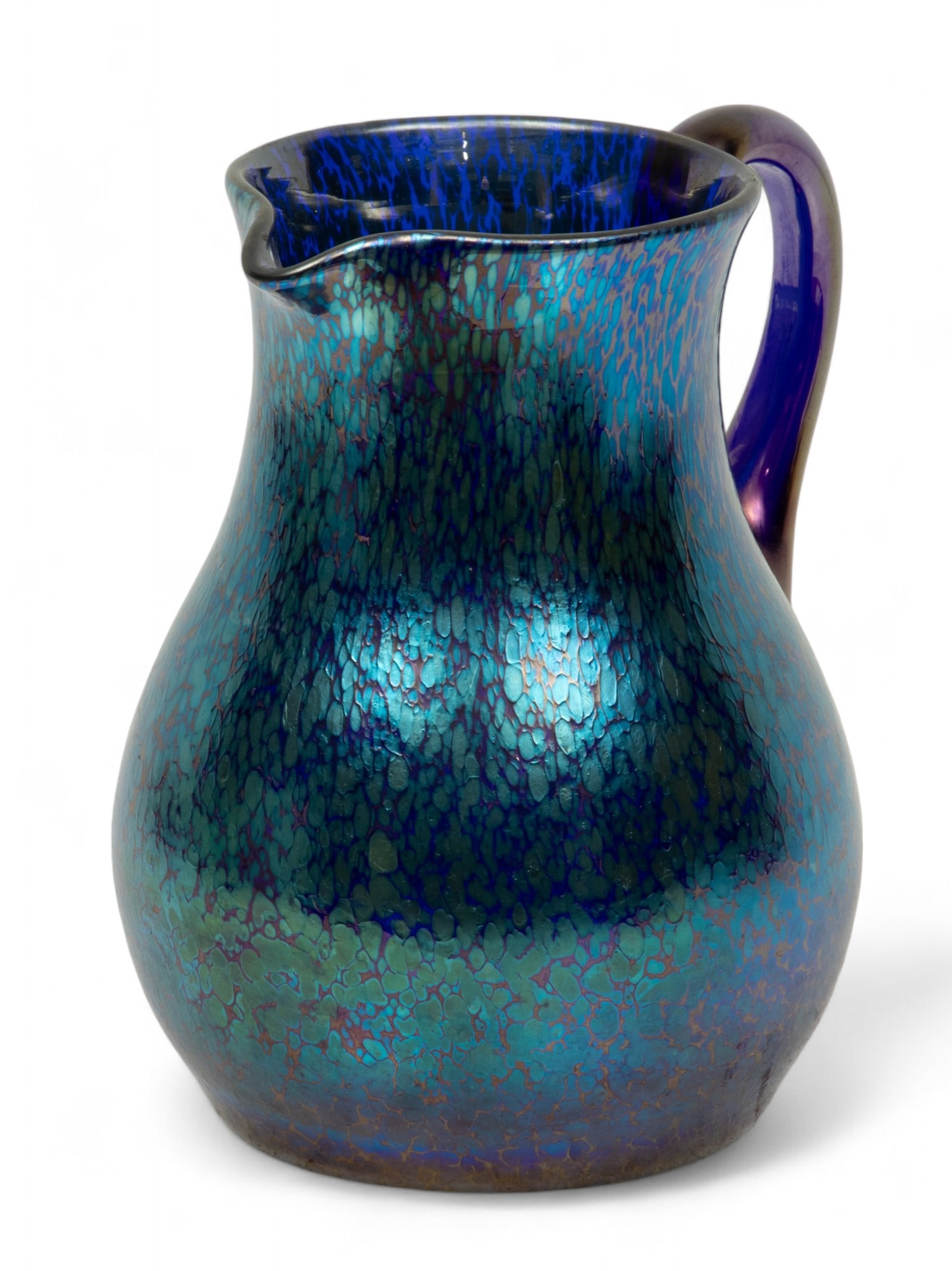 Loetz (Austrian) Cobalt Papillon Glass Pitcher, 1898, H 7.75" W 5" Depth 6.5": Loetz (Austrian) Cobalt Papillon Glass Pitcher, 1898, H 7.75" W 5" Depth 6.5" | the cobalt glass offers a marver of silver-yellow 'oil spot' granules. Unsigned. Provenance: Property from the collectio