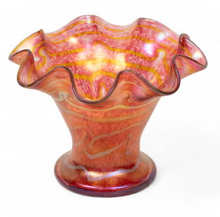 Glasfabrik Fritz Heckert Co. (German) Changeant Glass Vase, Ca. 1900, H 6.75" Dia. 9": Glasfabrik Fritz Heckert Co. (German) Changeant Glass Vase, Ca. 1900, H 6.75" Dia. 9" | Having a ruffled rim on tapering bodice and disc form base. with a silver meander throughout the exterior. Signe