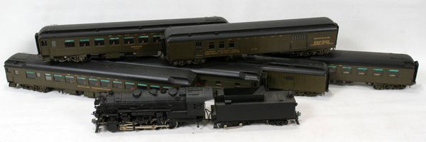 O SCALE TRAIN 0-4-0 ENGINE, TENDER, & PASSENGE: O SCALE TRAIN 0-4-0 ENGINE, TENDER, & PASSENGER CARS (6), EIGHT PIECES, L 8" - 18 1/2":Including 1 engine, L. 11", 1 tender, L. 8", and 6 Pullman, mail and passenger cars, L. 18 1/2".