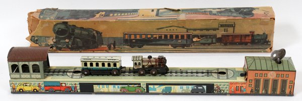 MECANICAL TIN TOY TRAIN RAILWAY ROUNDHOUSE: MECANICAL TIN TOY TRAIN RAILWAY ROUNDHOUSE WORKING-ORDER,ORIG-BOX U S ZONE GERMAN ARNOLD, 1, L 15":Mechanical Tin Windup Toy Train Round-House Railroad Track in Good Working Condition. Key Wind up. U.