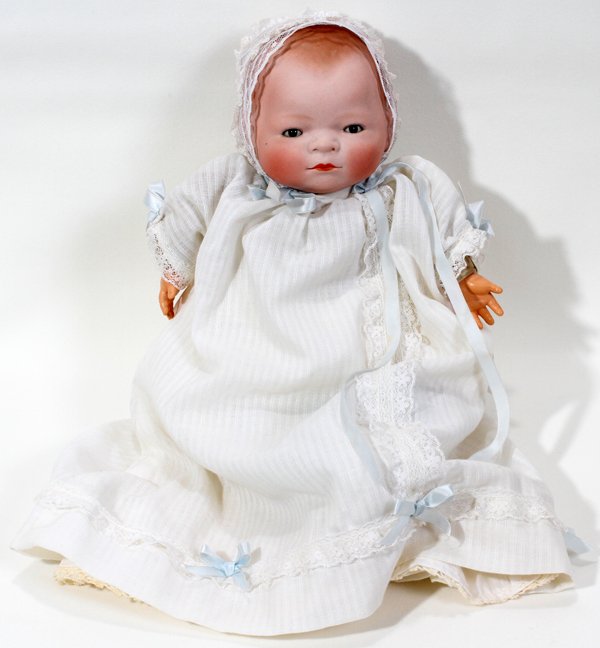 GRACE STOREY PUTNAM'BYE-LO'BISQUE & CLOTH DOLL: GRACE STOREY PUTNAM 'BYE-LO' BISQUE & CLOTH BABY DOLL, L 14":Bisque head, cloth body. Open shut blue eyes.