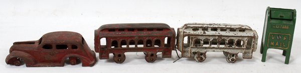 ANTIQUE PAINTED CAST IRON TOYS, FOUR, L 5"-6": ANTIQUE PAINTED CAST IRON TOYS, FOUR, L 5" - 6":Including 1 mailbox form bank, H. 3 3/4", 2 train cars, L. 5 1/2", and 1 car (with no wheels), L. 8".