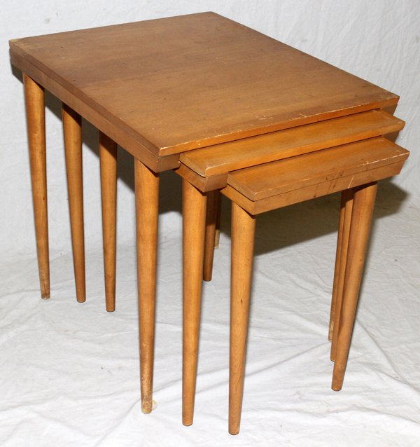CONANT BALL MAPLE NEST TABLES ATTRIB. R. WRIGHT: CONANT BALL MAPLE NEST OF THREE TABLES ATTRIBUTED TO RUSSEL WRIGHT, H 24", W 26":Each raised on round tapering legs. Stamped at the underside (see photo). Property of David Mikol Trust.
