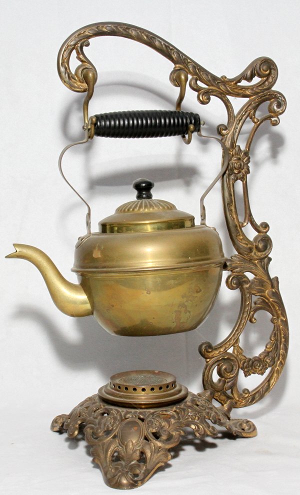 BRADLEY & HUBBARD IRON & BRASS TEAPOT & STAND: BRADLEY & HUBBARD IRON & BRASS TEAPOT & STAND, 1890, H 15":Marked at the underside of the stand.