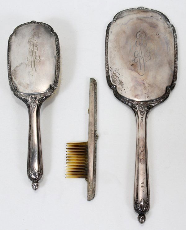 STERLING SILVER VANITY SET, 3 PIECES: STERLING SILVER VANITY SET: HAIR BRUSH, L 10", MIRROR L 13", COMB MOUNT L 7", #750, 3 PIECES:Shows Age and wear to mirror. No Comb, only Sterling Silver Mount. Brush Looks Good. The Long Handle Brush