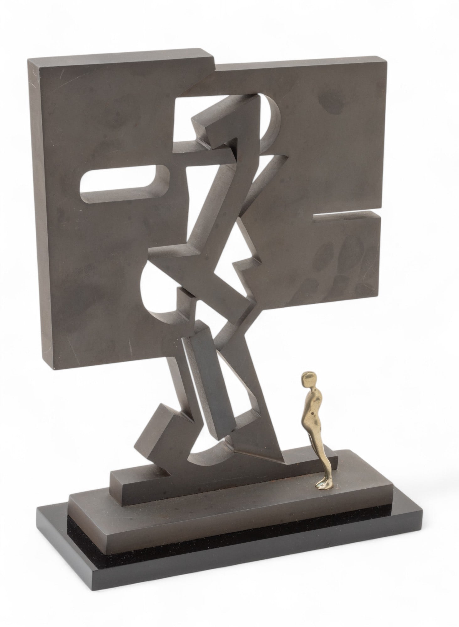 Ernest Trova (American, 1927-2009) Black Metal And Bronze Sculpture 1976, "F.M. Gox", H 11" W 8": Ernest Trova (American, 1927-2009) Black Metal And Bronze Sculpture 1976, "F.M. Gox", H 11" W 8" Depth 2" | Black metal sculpture on a black plexiglass base with white bronze figure. Label on undersid