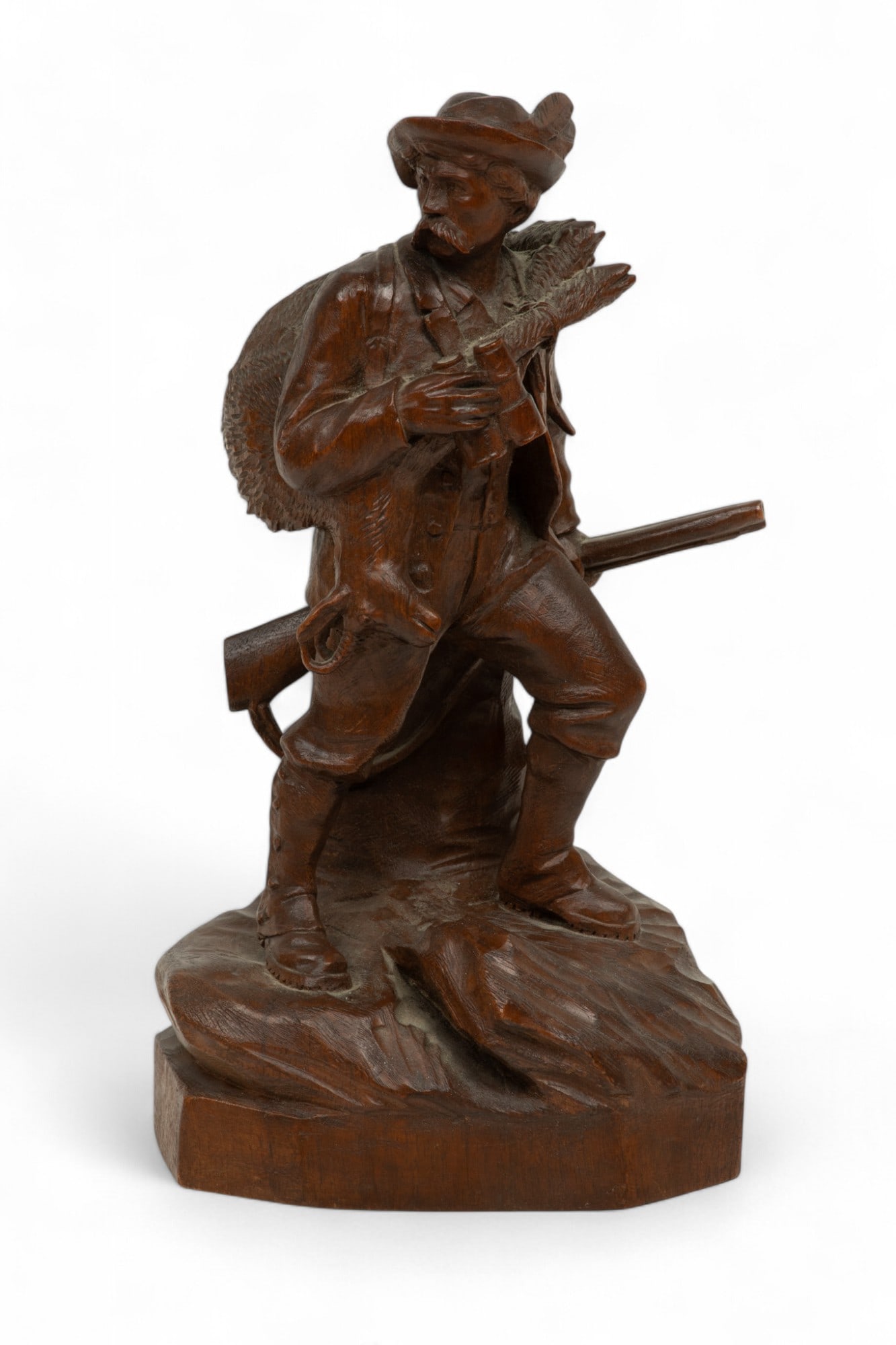 Germany Black Forest Carved Wood Hunter with Binoculars And Rifle Ca. 1900, H 11.5": Germany Black Forest Carved Wood Hunter with Binoculars And Rifle Ca. 1900, H 11.5" | Deer over his shoulder. Walnut wood single carving. No added elements. Provenance: Property of a Prominent Grosse