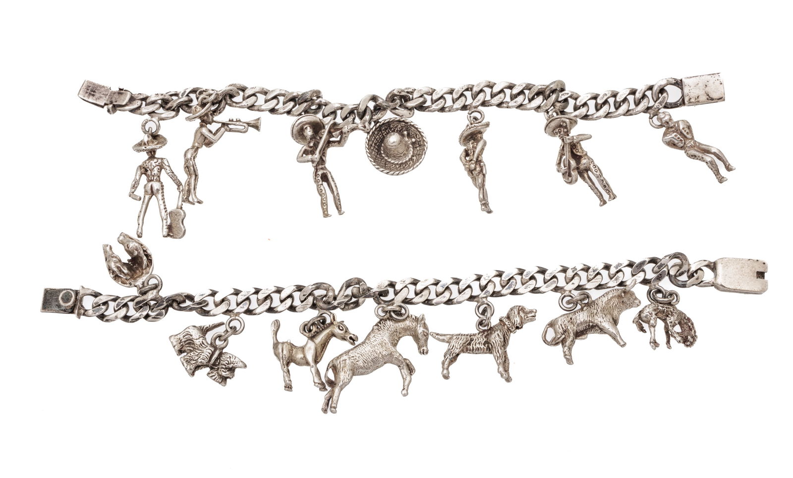 Two Silver Charm Bracelets L 7'': Two Silver Charm Bracelets L 7'' | with charms of animals and a Mariachi band.
