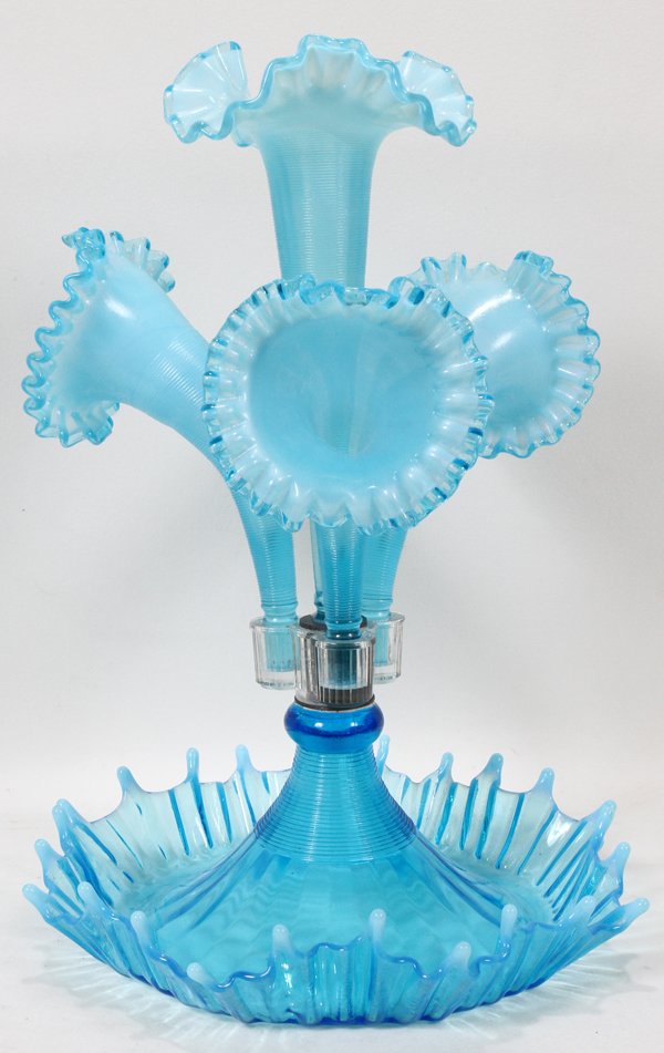 ANTIQUE BLUE GLASS EPERGNE, H 16", DIA 11": ANTIQUE BLUE GLASS EPERGNE, H 16", DIA 11":Blue with opalescent edge. Center lily form vase insert plus three outer vases.