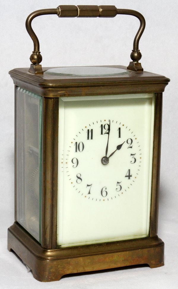 FRENCH BRASS & BEVELED GLASS CARRIAGE CLOCK: FRENCH BRASS & BEVELED GLASS CARRIAGE CLOCK, H 7 1/4", W 3 3/4":Stamped "Made in France" on the works.